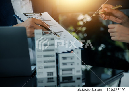 Real estate agent and customer signing contract to buy house, insurance or loan real estate.rent a house,get insurance or loan real estate or property. Real estate agent and customer signing contract to buy house, insurance or loan real estate.rent a house,get insurance or loan real estate or property. 120827491
