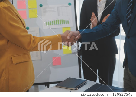 Hand shake business,Young business people shaking hands in the office. Finishing successful meeting. Three persons Hand shake business,Young business people shaking hands in the office. Finishing successful meeting. Three persons 120827543