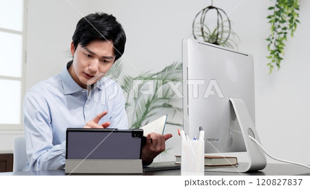 A man examining documents and resolving problems 120827837