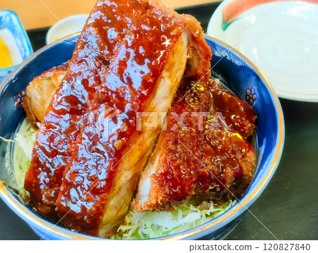 Thickly cut pork loin with sauce and rice Thickly cut pork loin with sauce and rice 120827840