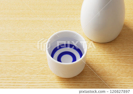 Sake poured into a white sake cup 120827897