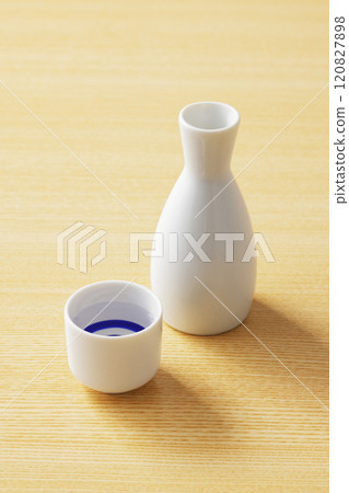 Sake poured into a white sake cup 120827898