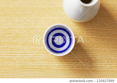 Sake poured into a white sake cup 120827899