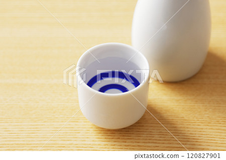 Sake poured into a white sake cup 120827901