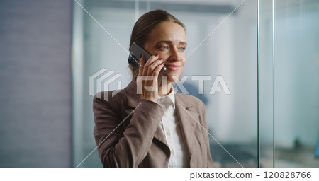 Successful businesswoman discusses business strategy with partner on mobile phone Successful businesswoman discusses business strategy with partner on mobile phone 120828766