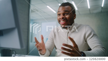 Successful African American businessman chats with business partner and rejoices 120828800