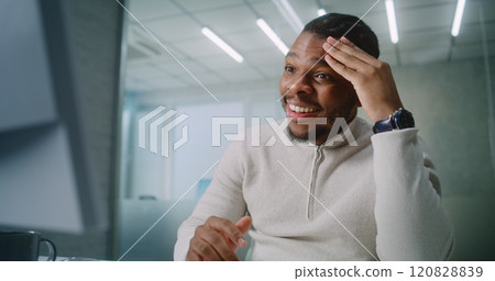 Successful African American businessman chats with business partner and rejoices Successful African American businessman chats with business partner and rejoices 120828839