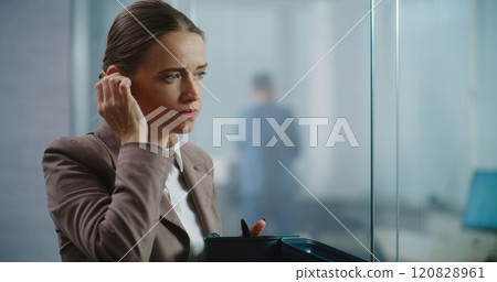 Marketing specialist eats food, discusses business strategy using wireless headphones 120828961