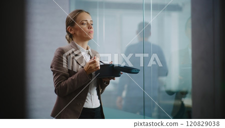 Businesswoman or office worker eats food from delivery during lunch in modern office 120829038