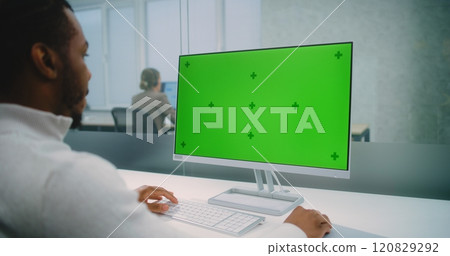 African American financial expert works on personal computer with green screen chromakey 120829292
