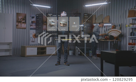 Artisan in VR headset assembles chair using app with AI user interface. 3D graphics of holographic furniture 120829295