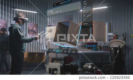 Modern workshop: Craftsman wearing AR headset assembles furniture in virtual space Modern workshop: Craftsman wearing AR headset assembles furniture in virtual space 120829300