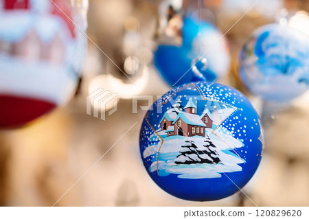 Hand-Painted Christmas Ornaments Hanging in Market Hand-Painted Christmas Ornaments Hanging in Market 120829620