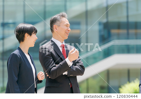Smiling businessmen in front of their office Smiling businessmen in front of their office 120830444