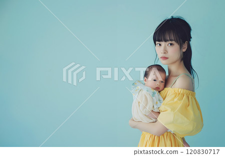 A natural portrait of an Asian baby and mother surrounded by love 120830717