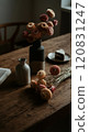 Dried flowers and cake on old desk 120831247