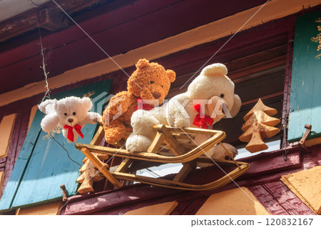 Christmas decoration with toys and teddy bears on a facades in Alsace, France 120832167