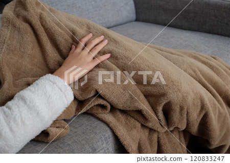 Arms and hands of a girl relaxing on a sofa 120833247