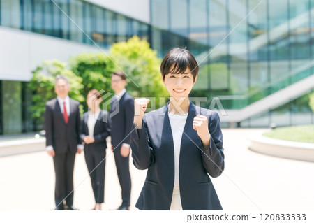 Young woman in a suit wearing a guts pose 120833333