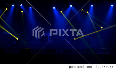 Blue and yellow stage lights with smoke 120834033