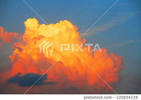 A majestic and powerful sunset skyscape with developed cumulonimbus clouds A majestic and powerful sunset skyscape with developed cumulonimbus clouds 120834139