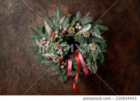 Christmas wreath on a brown vintage background. Christmas wreath on a brown vintage background. 120834443