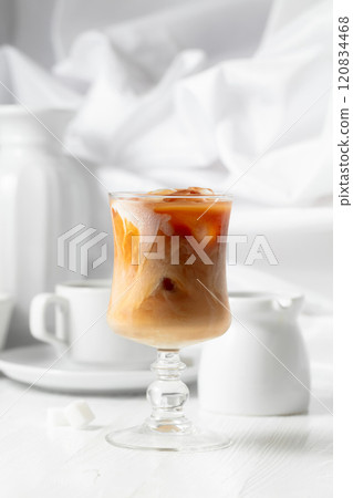 Iced coffee with cream and cup of black coffee. Iced coffee with cream and cup of black coffee. 120834468