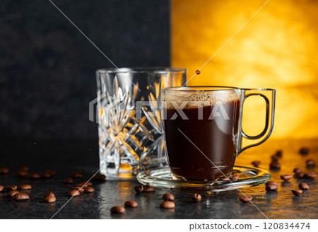 Espresso, glass of cold water, and roasted coffee beans. Espresso, glass of cold water, and roasted coffee beans. 120834474