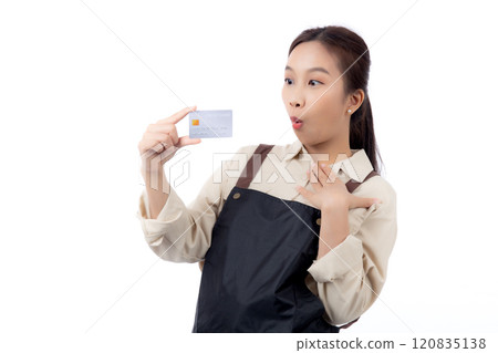 Portrait happiness young asian woman wearing apron holding credit card isolated. 120835138