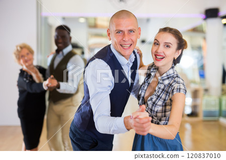 Man and woman dancing waltz in studio Man and woman dancing waltz in studio 120837010