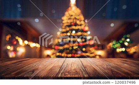 Empty wooden table with blurred christmas tree background illuminating festive atmosphere Empty wooden table with blurred christmas tree background illuminating festive atmosphere 120837496