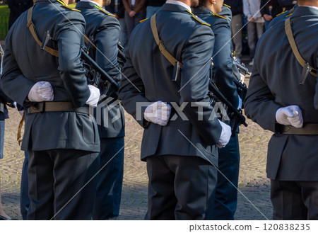 Italian army soldiers standing in formation during a formal outdoor ceremony 120838235
