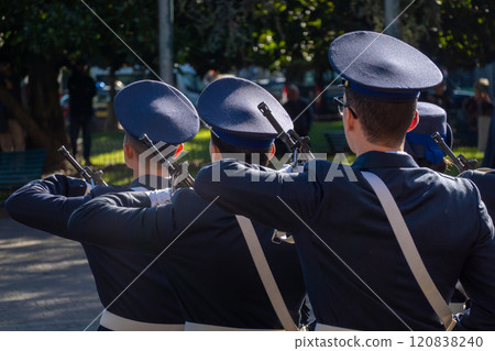 Back view of Italian soldiers in uniform during outdoor ceremony 120838240