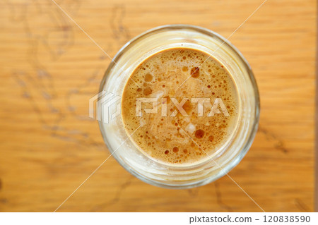 Cup of Dirty coffee on rustic wooden background. Selective focus. Top view. Cup of Dirty coffee on rustic wooden background. Selective focus. Top view. 120838590