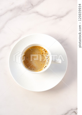 A top-down view of a mug of freshly brewed coffee A top-down view of a mug of freshly brewed coffee 120839934