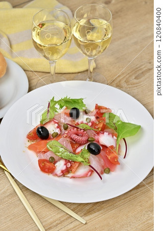 Carpaccio, carpaccio salad. Salmon, sea bream, octopus, cherry tomatoes, baby leaves, olive oil. Carpaccio, carpaccio salad. Salmon, sea bream, octopus, cherry tomatoes, baby leaves, olive oil. 120840400