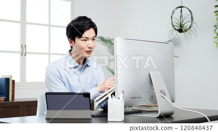 A man examining documents and resolving problems 120840437