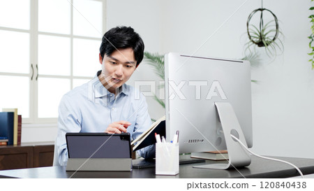 A man examining documents and resolving problems 120840438