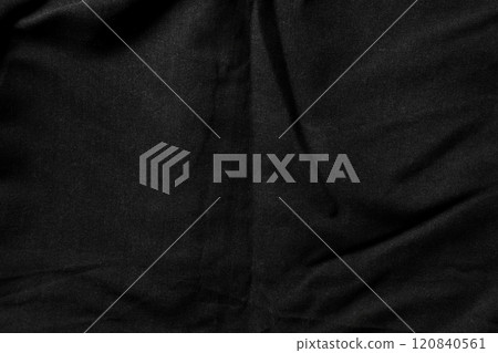 Close-up of black fabric with subtle folds and a soft dusty matte texture. Minimalist abstract backgrounds or textile design. Top view shot 120840561