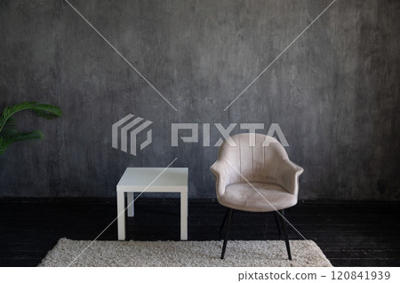 one old vintage chair in the interior of a dark room 120841939