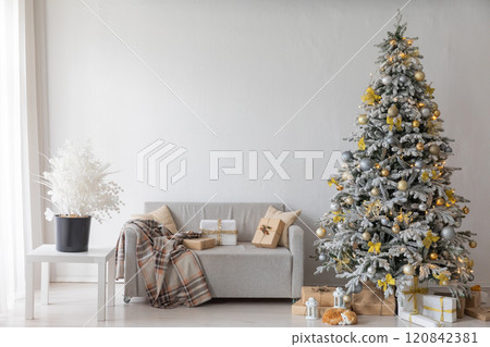 White Christmas tree with gifts garlands in the interior for the new year 120842381