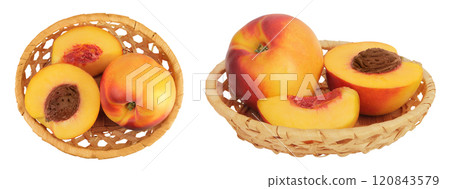 Ripe nectarine fruit with half in a wicker basket isolated on white background with full depth of field. Top view. Flat lay Ripe nectarine fruit with half in a wicker basket isolated on white background with full depth of field. Top view. Flat lay 120843579