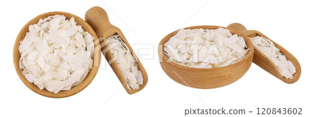Coconut flakes or chips in wooden bowl isolated on white background. Top view. Flat lay 120843602