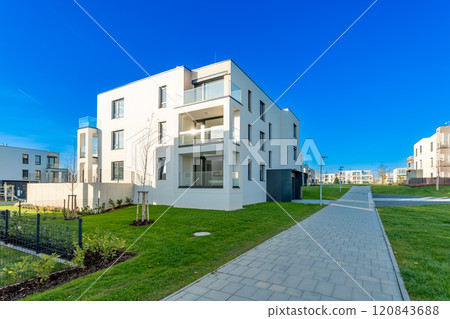 Modern residential building with balconies in a suburban neighborhood Modern residential building with balconies in a suburban neighborhood 120843688