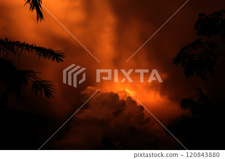 The colors of the clouds and the sky are orange and dark The colors of the clouds and the sky are orange and dark 120843880