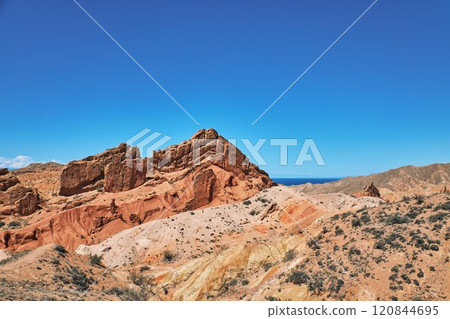 Picturesque Skazka canyon on the southern shore of Issyk-Kul lake, Kyrgyzstan 120844695