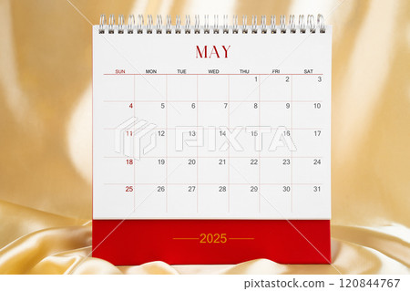 May Desk calendar for 2025 year on gold color silk background. Blank calendar. 120844767