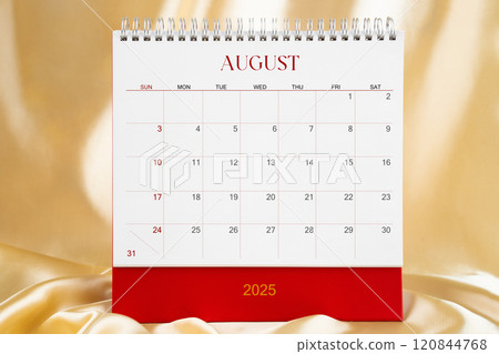 August Desk calendar for 2025 year on gold color silk background. Blank calendar. 120844768
