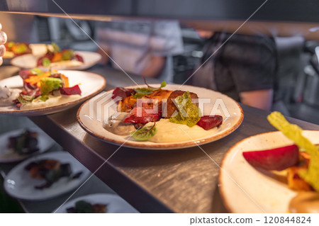 Plates with delicious roasted meat 120844824