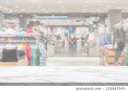 marble table top with blur clothing boutique display interior shopping mall background marble table top with blur clothing boutique display interior shopping mall background 120845543